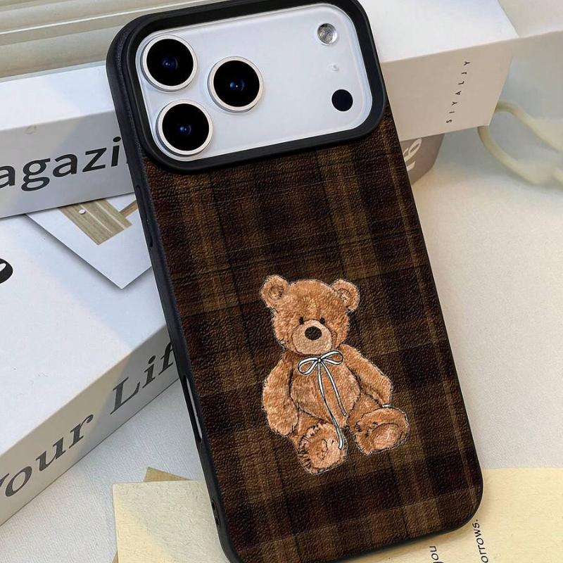 Teddy Bear Phone Case - shown beside a bare iPhone, embroidered bear and camera cut-out