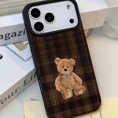 Teddy Bear Phone Case - shown beside a bare iPhone, embroidered bear and camera cut-out